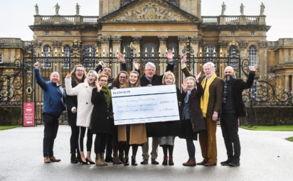 Blenheim staff hand over giant cheque to loneliness charity