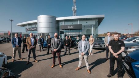 Nick Dughan Centre Principal, (centre), stands with his team at Lexus Derby